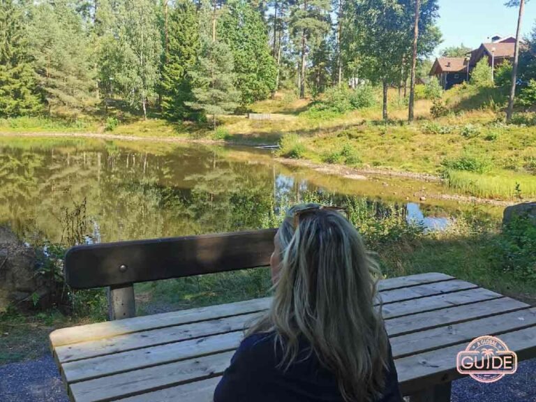 A lake in Småland With a Girl Sitting In Front