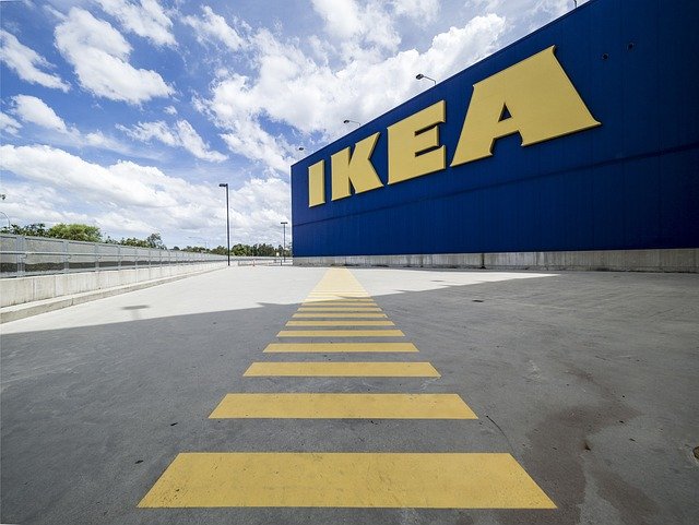 Picture of IKEA sign on a blue wall.