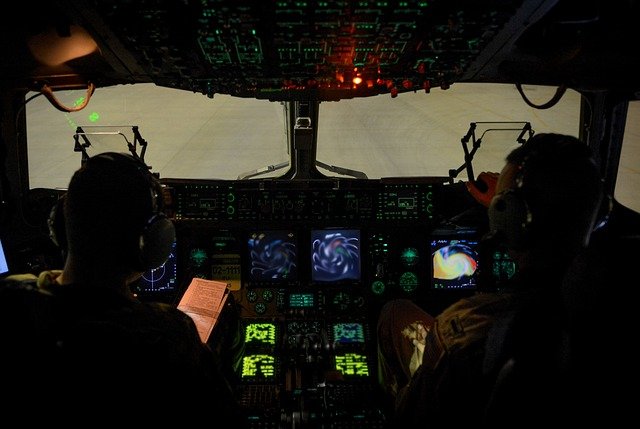 Inside a cockpit with two pilots.